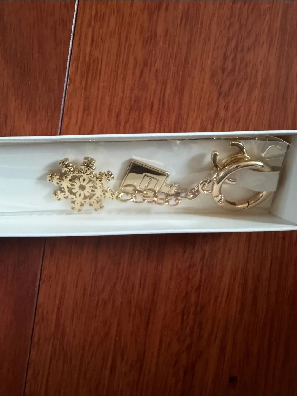 CHANEL Gold Snowflake and Bag Charm Key Ring